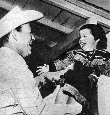 Roy Rogers in 1955 with 2 year old daughter Dodie.