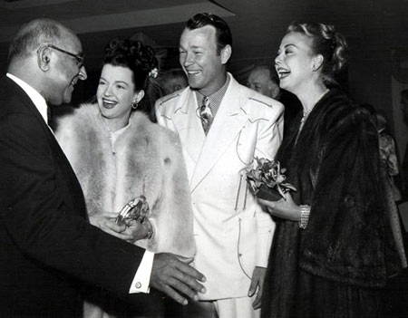 An unidentified man (Is that Republic Studio head Herbert J. Yates?) greets Dale Evans, Roy Rogers and Vera Ralston at a function in the mid to late ‘40s.