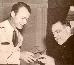 Roy presents a pair of silver spurs to Mayor Fiorello LaGuardia during a NY visit in 1943.