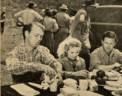 Taking a lunch break while filming “Branded” in Arizona are (L-R) Alan Ladd, Mona Freeman and Peter Hansen.