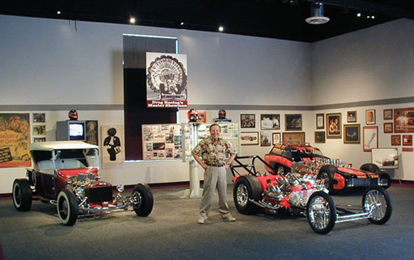 Cars of the Stars: TV Tommy Ivo, a member of the Drag Racing Hall of Fame, poses beside some of the dragsters he built in his garage at the NHRA Motorsports Museum in Florida. Ivo’s incredible T-Bucket hot rod is on the left.