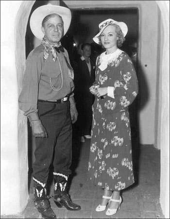 Hoot Gibson and leading lady June Gale in 1935. The pair filmed “Rainbow’s End” for Fist Division together and were romantically linked for a spell. June was one of four Gale sisters—June, Jane, Joan, Jean—who appeared in vaudeville, George White’s Scandals and at the Palladium in London.