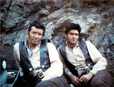 The late Peter Breck and his stuntman/double Chuck Bail take a break while filming “Big Valley”. (Thanx to Chuck Bail.)