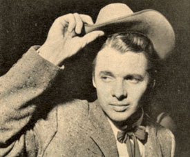 Audie Murphy doffs his hat for fans at the premiere of “Destry” (‘55).
