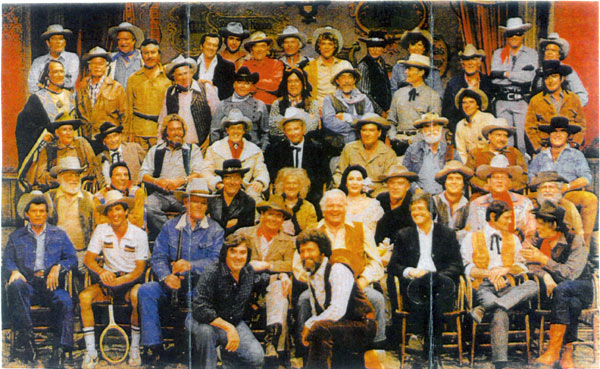 A true Gathering of Guns: “When the West was Fun” aired on ABC TV in 1979. (Top row l-r) Rod Cameron, Jock Mahoney, Jack Kelly, Tony Young, John McIntire, Ty Hardin, Darby Hinton, Lee Van Cleef, Will Hutchins, Clayton Moore and Doug McClure. (2nd row l-r) X Brands, Bill Williams, Michael Ansara, Slim Pickens, Dick Jones, Don Diamond, Ken Curtis, John Russell, Terry Wilson, Peter Brown, James Drury. (3rd row l-r) Pat Buttram, Milburn Stone, Dan Haggerty, Guy Madison, Rex Allen, John Bromfield, Keenan Wynn, Jackie Coogan, George Montgomery. (4th row l-r) Denver Pyle, Iron Eyes Cody, Harry Lauter, Jeanette Nolan, Linda Cristal, John Ireland, Mark Slade, Joe Bowman, Fred Putnam. (Front row l-r) Dewy Martin, Johnny Crawford, Chuck Connors, Glenn Ford, Alan Hale Jr., Henry Darrow, Larry Storch and Neville Brand. The two producers of the special are kneeling in front.