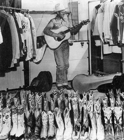 Gene Autry in his clothes closet. (Thanx to Jerry Whittington.)