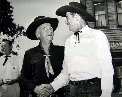 William Boyd as Hopalong Cassidy shakes hands with screen badman Glenn Strange. Russell Hayden in the background. (Thanx to Bobby Copeland.)