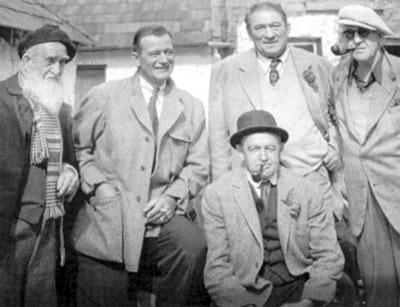 On the set of “The Quiet Man” (‘52 Republic), (L-R) Francis Ford (John Ford's brother), John Wayne, Victor McLaglen and director John Ford with Barry Fitzgerald seated.