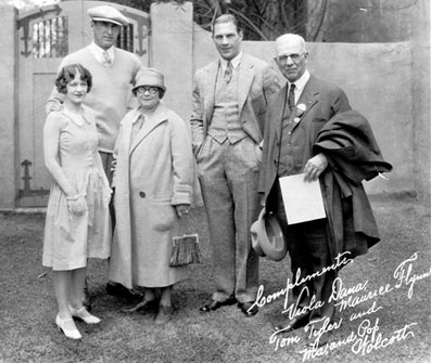 (L-R) Viola Dana, a major star in the silent era, noted silent western star Maurice “Lefty” Flynn, Tom Tyler and, as noted on the photo, Ma and Pop Wolcott. Unknown who they might have been. (Thanx to Bobby Copeland.)