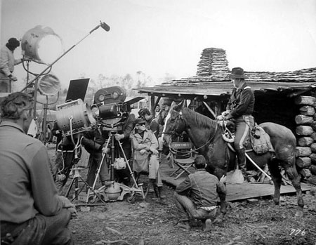 John Ford, beside the camera, sets up a scene with John Wayne in “The Horse Soldiers”.