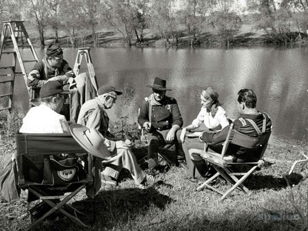 John Ford (center) talks over a “Horse Soldiers” scene with John Wayne, Constance Towers and William Holden. Believe that's Judson Pratt by the stepladder.