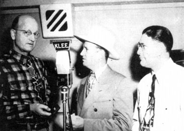 In April 1948, Gene Autry received his official receipt as a Houston Aerie member in the Fraternal Order of Eagles. With Gene are Eagle W. Albert Lee, KLEE radio station owner, and Jake Colca, Eagle Grand Outside Guard.