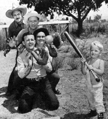 Ted French, musician Don Weston, Dub Taylor and Jimmy play catch as Johnny is at bat. 