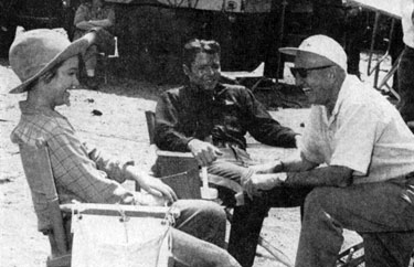 Kathy Grant, Audie Murphy and director George Marshall take a break from filming “The Guns of Fort Petticoat” (‘57).