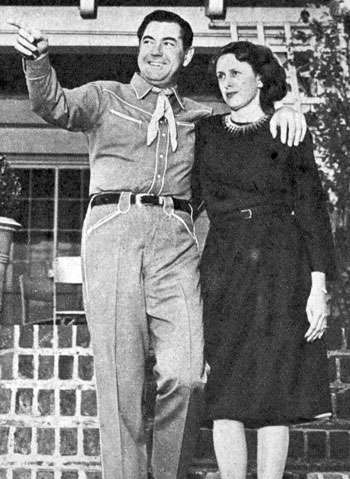 Johnny Mack Brown and his wife, the former Cornelia Foster, in 1946 in front of their 16 room English colonial house in Beverly Hills.