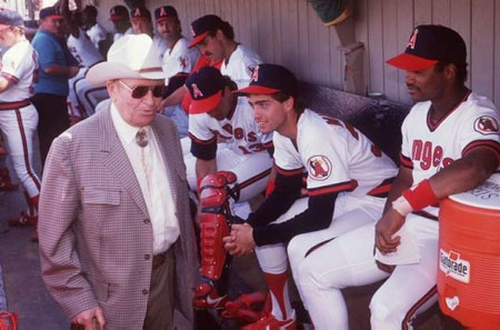 Angels team owner Gene Autry walks through the Angels’ dugout during a 1989 Spring training game in Palm Springs.