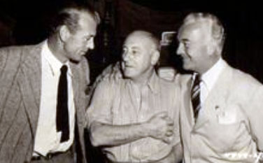 Gary Cooper and William Boyd chat with director Cecil B. De Mille in 1940. (Thanx to Jerry Whittington.)