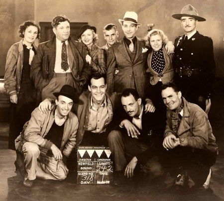 Cast and crew of the Canadian made “Undercover Men” (‘35). (L-R standing). Unidentified woman, director Sam Newfield, heroine Adrienne Dore, unidenitfied man, Kenne Duncan, unidentified woman, Wheeler Oakman. (Kneeling L-R). Unidentified man, Charles Starrett, possibly Eric Clavering, Phil Brandon. (Thanx to Jerry Whittington.)