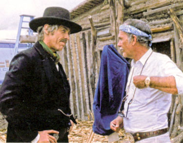 James Coburn and director Sam Peckinpah discuss a scene while making “Pat Garrett and Billy the Kid” (‘73).