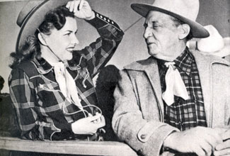 Gale Storm chats with Raymond Hatton at the Palm Springs rodeo circa 1952.