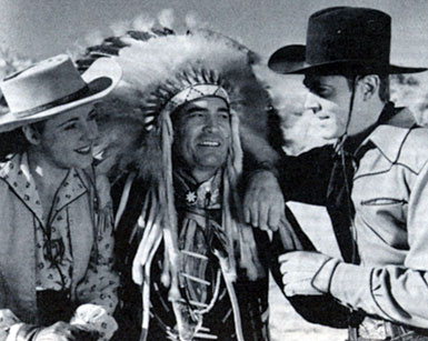 Kay Aldridge, Chief Thunder Cloud and Allan Lane chat while making Republic’s “Daredevils of the West” serial (‘43).