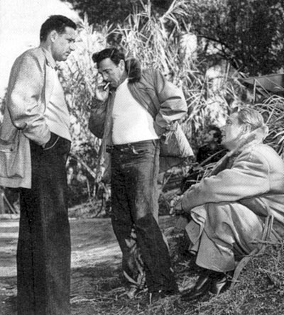 Director Gordon Douglas (center) confers with producer Marty Rackin and Alan Ladd during the shooting of “Santiago” (‘56) set in Cuba during the 1898 conflict between the U.S. and Spain.