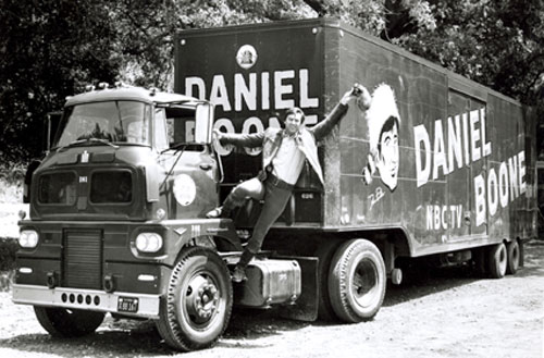 Ready for the fourth season of “Daniel Boone”, Fess Parker waves a go-ahead from the cab of the 40 ft. 20th Century-Fox property truck. (Thanx to Neil Summers.)