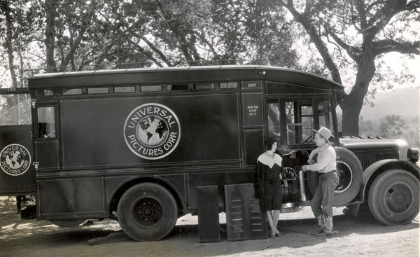 Hoot Gibson and his leading lady stand beside a Universal Sound truck in the early ‘30s.