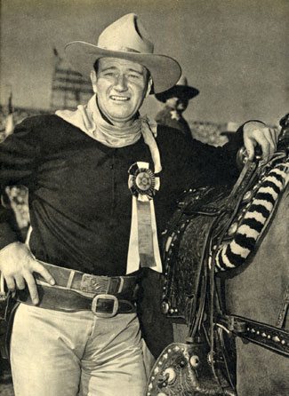 Rodeo Grand Marshal John Wayne. Note the “Red River” belt buckle.