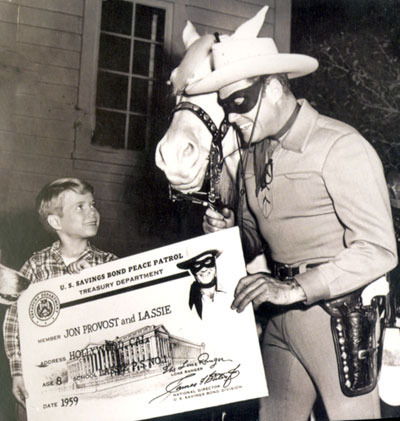 Jon Provost of “Lassie” and Clayton Moore as the Lone Ranger promote the U.S. Savings Bond Peace Patrol for the Treasury Dept. in 1959.