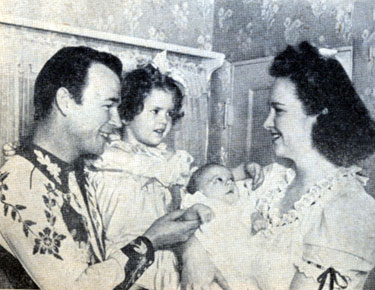 Roy Rogers with three year old daughter Cheryl, months old Linda Lou and wife Arlene in mid 1943.