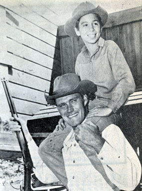 Chuck Connors and Johnny Crawford on the set of “The Rifleman”.