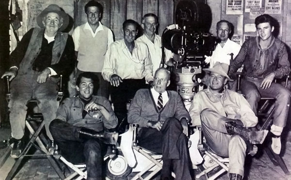 The main cast and crew of “Rio Bravo” (‘59 WB). (L-R front) Walter Brennan, Dean Martin, director Howard Hawks, John Wayne, Ricky Nelson. (Thanx to Jerry Nolan.)