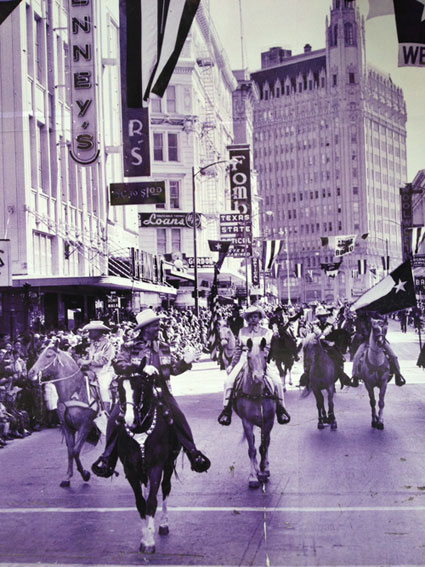 Gene Autry leads a parade in downtown San Antonio, TX. Gene was there for the Livestock Show and Rodeo in 1958.