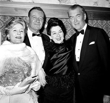 Irene Dunne, John Wayne, Rosalind Russell and James Stewart at the premiere of “How the West Was Won” in 1962.