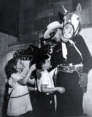 Quiz Kids Ruth Duskin and Joel Kupperman visit the Lone Ranger, Brace Beemer, and his horse Silver at the NBC studios in the early ‘40s.