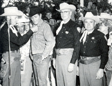 TV’s “Stoney Burke”, Jack Lord, receives an honorary membership into the Albuquerque Sheriff’s Posse during his appearance at the 1964 New Mexico State Fair.