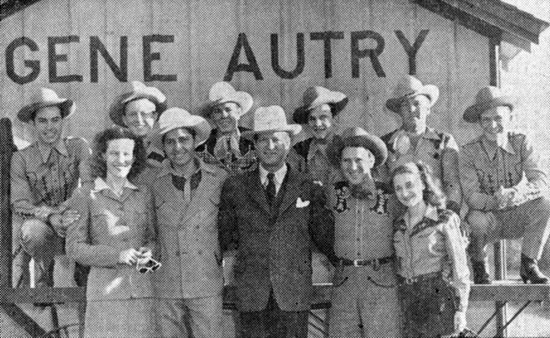 Photo in Gene Autry, OK, in 1945. Berwyn, OK, became Gene Autry, OK, on November 5, 1941. (L-R) Minnie Pearl, Gene’s brother Doug, Golden West Cowboy’s manager Adams, Pee Wee King, Becky Barfield. Pee Wee's Golden West Cowboys in the back.