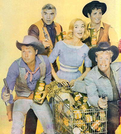 Protecting Mrs. Smart Buyer and her cart full of Del Monte products are Lorne Greene and Michael Landon of “Bonanza”, John Smith of “Laramie” and Doug McClure of “Overland Trail”.