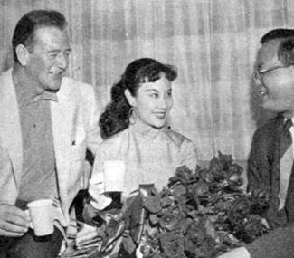 John Wayne with Li Hua Li, the number 1 boxoffice star in the Far East at the time, with her brother. Wayne’s Batjac Productions was preparing Li to star in “China Doll” with Victor Mature in ‘58.