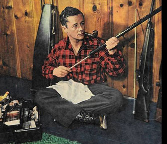 Tim Holt keeps his hunting rifles clean in 1948. (Thanx to Bobby Copeland.)