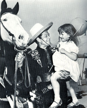 Duncan Renaldo, the Cisco Kid with his horse Diablo, greet five year old Natalie Fiske in Tucson, AZ, in March 1956 while Renaldo was appearing with the Clyde Beatty Circus.