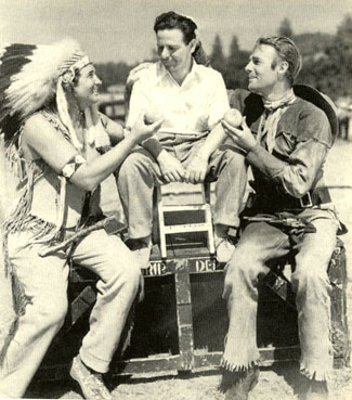 Monte Blue, director Charles Barton and Randolph Scott on location for “Wagon Wheels” (‘34).