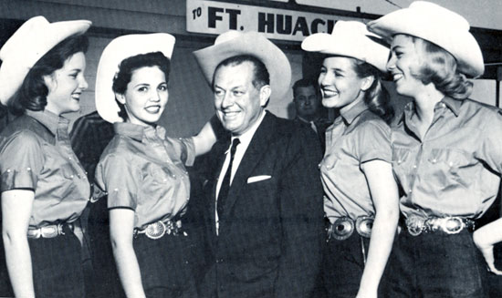 Vaughn Monroe, who made a couple of good Westerns for Republic, is greeted in February 1958 by the Tucson, AZ, Sunshine Climate Club. (L-R) Pat Coleman, Cecilia Quiroz, Sue Rowton and Sandy Gustafson.