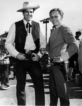 Tom Tryon (“Texas John Slaughter”) and Jan Merlin (“Rough Riders”) pose together at a 1958 charity event. The pair had previously worked together on “Screaming Eagles” in 1956.