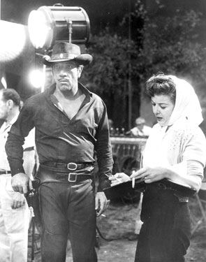 Richard Boone and director Ida Lupino work on a scene for “Have Gun Will Travel”.