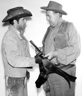 Robert Fuller and Roy Barcroft on location for an episode of “Laramie”.