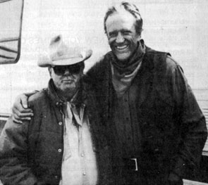 Costumer Luster Bayless poses with James Arness on the set of “Gunsmoke: To the Last Man” in 1992.