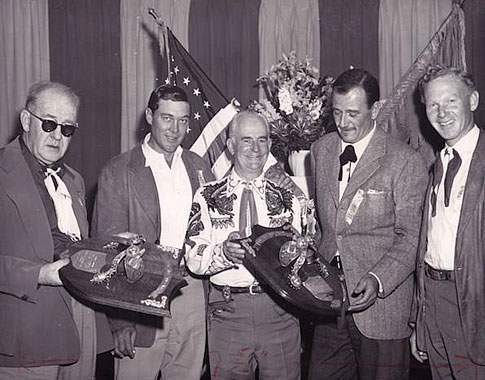John Ford and John Wayne accept Silver Spur Awards in ??. Accompanying them are Ben Johnson and Harry Carey Jr.