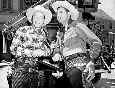 Roy Rogers and Ray “Crash” Corrigan on the Republic backlot during the filming of “Trail of Robin Hood” (‘50).